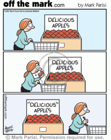 Customer marks quotes on gross taste “delicious” apples grocery store sign.
